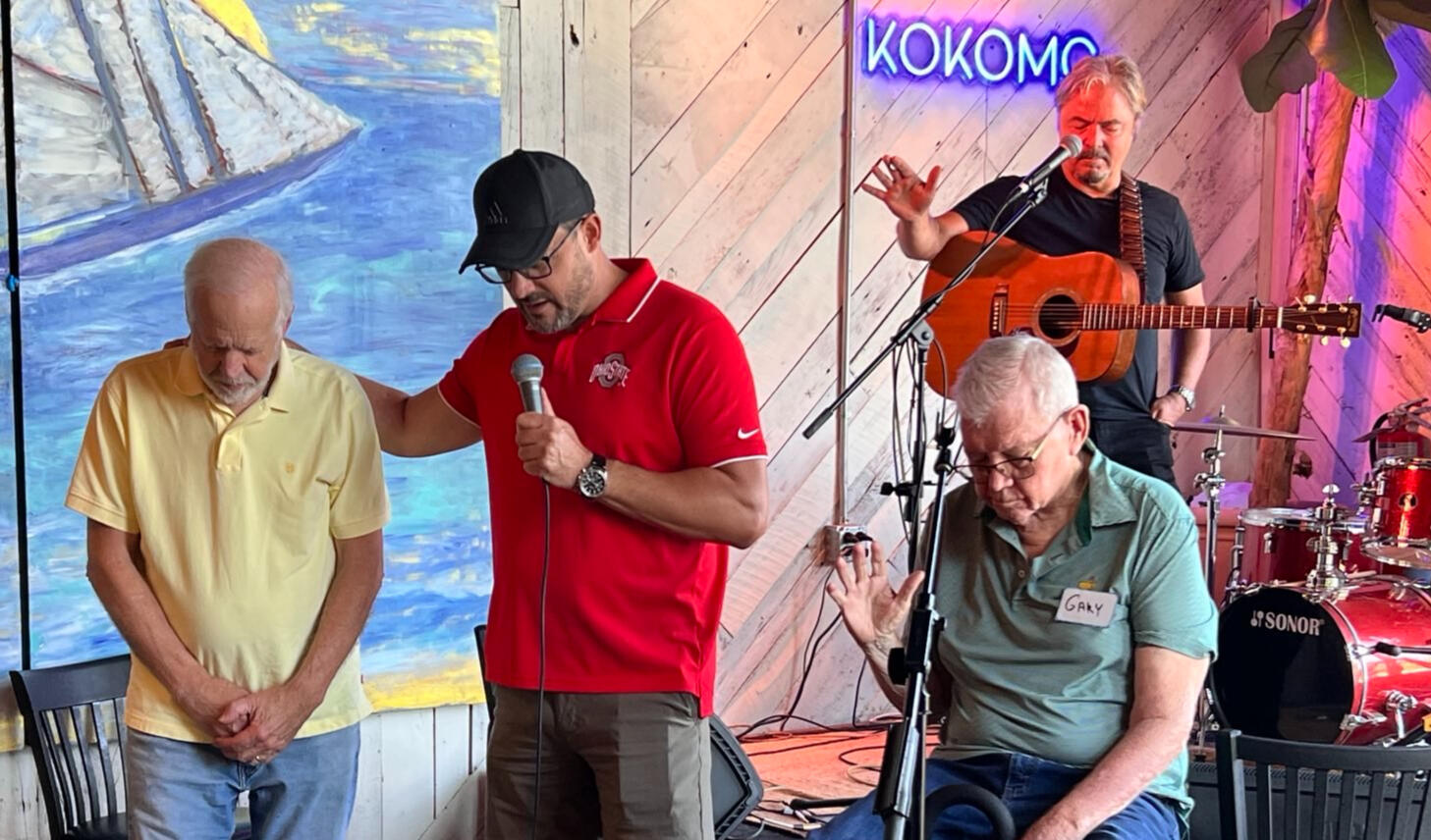 Bill prays at a Men's Group Friday meeting
